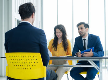 Job interview concept. diverse hr team doing job interview with a man in business office. human