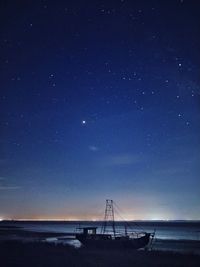 Scenic view of sea against sky at night