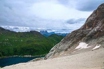 Scenic view of land and mountains against sky