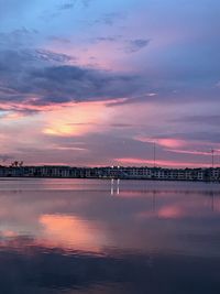 Scenic view of lake against romantic sky at sunset