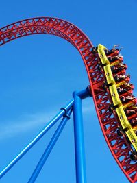 Low angle view of eiffel tower against blue sky