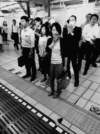 Full length of man standing on tiled floor