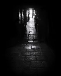 Empty alley amidst buildings in city