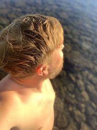 Portrait of shirtless boy on beach