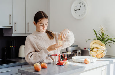 Cute girl preparing food at home