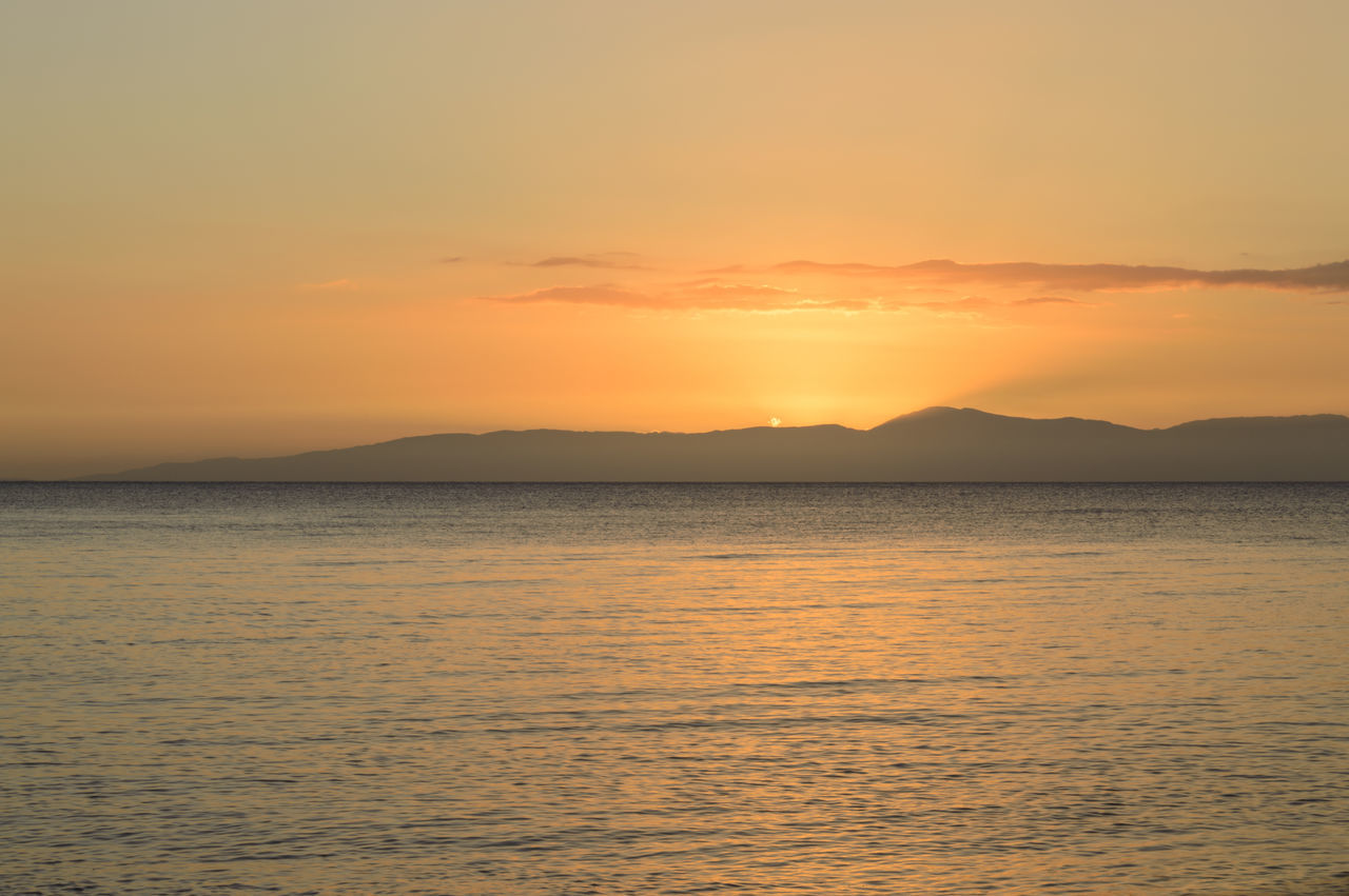 sunset, sea, tranquility, beauty in nature, nature, scenics, water, tranquil scene, sky, no people, idyllic, outdoors, sun, waterfront, silhouette, horizon over water