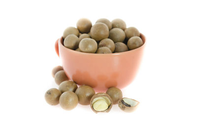 Close-up of eggs in bowl against white background