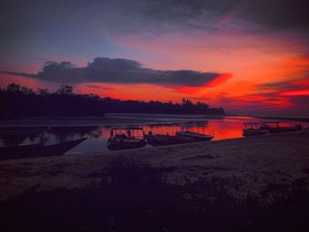 Scenic view of lake against romantic sky at sunset