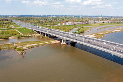 Aerial from bridge over the river lek with the highway a2 near utrecht in the netherlands