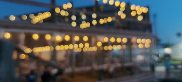 Defocused image of illuminated lights at night