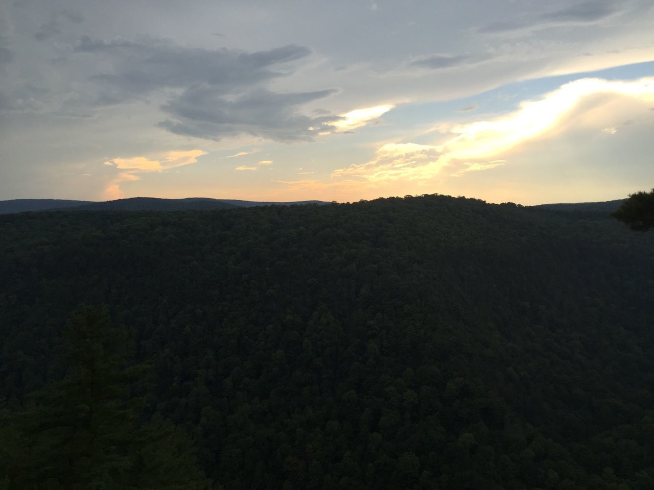 SCENIC VIEW OF MOUNTAINS AT SUNSET