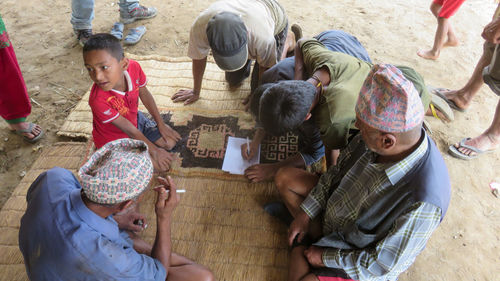 High angle view of people sitting outdoors