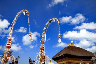 Low angle view of traditional building against blue sky