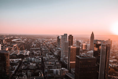 High angle view of buildings in city during sunset