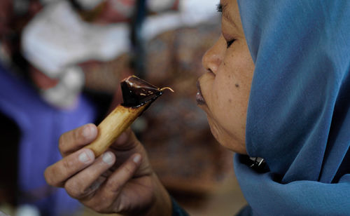 Close-up of man holding ice cream