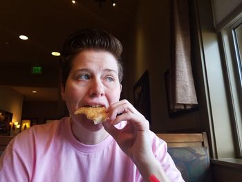 Close-up of woman sitting at restaurant