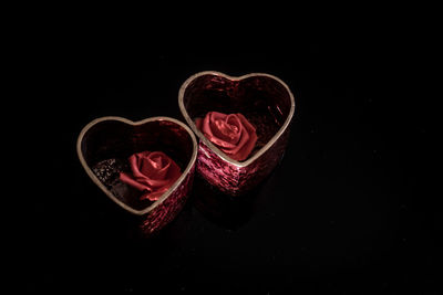 Close-up of heart shape over black background