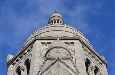 Low angle view of church against blue sky