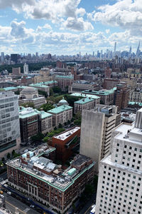 High angle view of buildings in city against sky