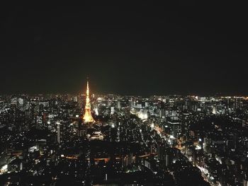 Aerial view of city lit up at night