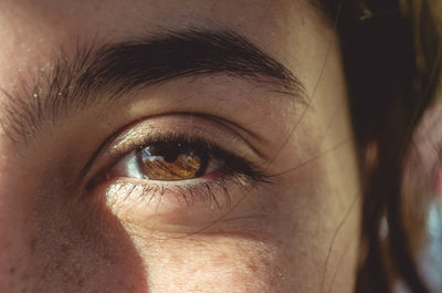 Close-up of woman with brown eye