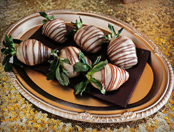 Close-up of chocolate covered strawberries in plate on table