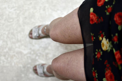 Low section of woman standing outdoors