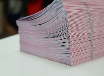 Close-up of paper stack on table