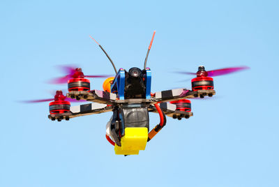 Airplane flying against clear blue sky