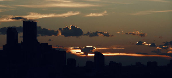 Silhouette of city at dusk