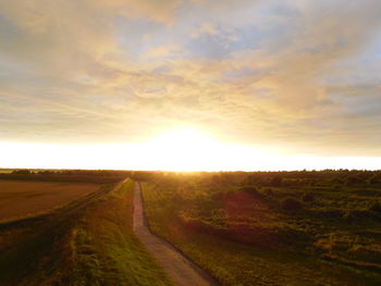 Road passing through field