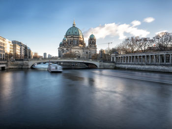 View of bridge over river in city