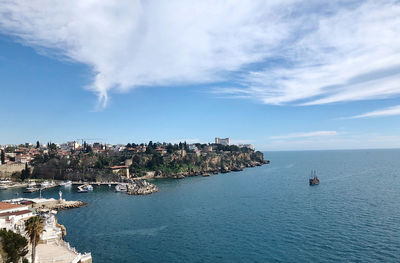 Panoramic view of sea and buildings against sky