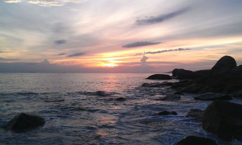 Scenic view of sea at sunset