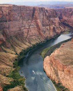 High angle view of river amidst mountains