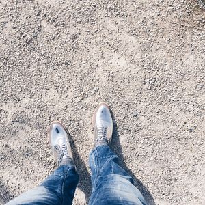 Low section of person standing on ground