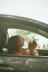 Portrait of children in car