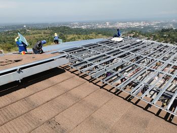 Workers working on rooftop