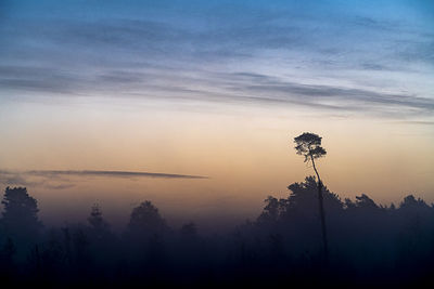 Scenic view of silhouette landscape against sky during sunset