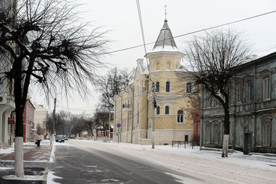 View of church in city against clear sky