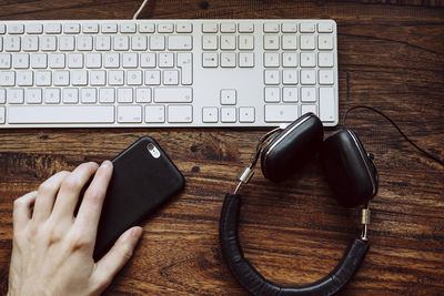 Close-up of person using laptop on table