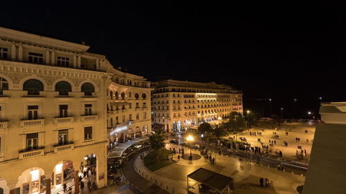 High angle view of illuminated buildings in city at night