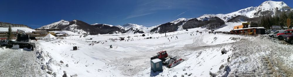 Panoramic view of snowcapped mountains against sky