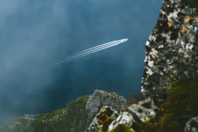 Aerial view of mountain by sea