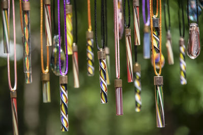 Close-up of clothespins hanging on clothesline