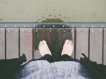 Low section of man standing on floor