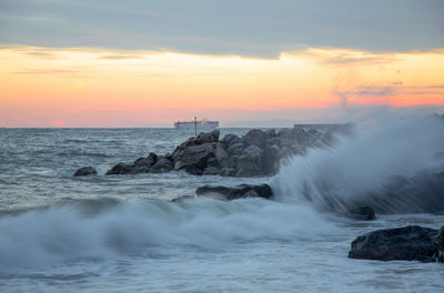 Scenic view of sea against sky during sunset