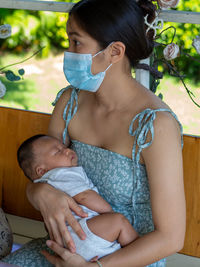 Woman and baby asian and nationality thai is happy feel