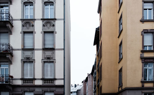 Low angle view of buildings against clear sky