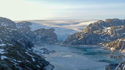 Scenic view of snowcapped mountains against sky